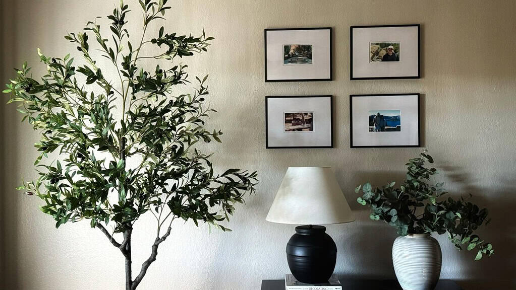 A fake olive tree for a modern interior space, with a elegant tree style that fits seamlessly into the room.
